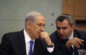 Israel's Prime Minister Benjamin Netanyahu listens to Foreign Affairs and Defence committee chair Zeev Elkin during a committee meeting at parliament in Jerusalem June 2, 2014.Ronen Zvulun/Reuters