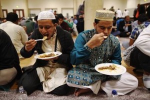 Muslims at the East London Mosque break their fast after a long day of no food or water.