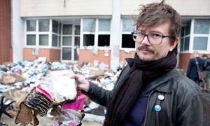 Charlie Hebdo illustrator Luz stands outside the magazine's offices after it was firebombed in 2011. (Photo: Revelli-Beaumont/SIPA/Rex Features)