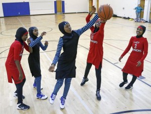In this June 16, 2015 photo, East African Muslim girls practiced basketball in their new uniforms in Minneapolis. Muslim girls who play sports have challenges that go beyond the sporting. Their new culturally sensitive uniforms, designed by the girls, address worries over tripping on a long, flowing dress, or having a loosely wrapped hijab come undone during a crucial play. (AP Photo/Jim Mone) Read more: http://www.washingtontimes.com/multimedia/collection/new-sports-uniforms-level-the-playing-f-2015-07-01/#ixzz3fzuKYChI Follow us: @washtimes on Twitter 